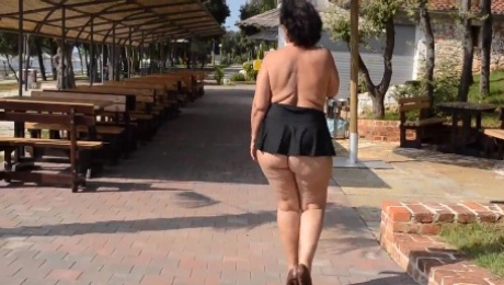 Mature Lady Naked Big Ass in Miniskirt Outdoors