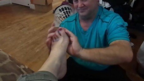 Slave boy rubs lotion on Mistress Victoria and puts on her socks shoes 4 her
